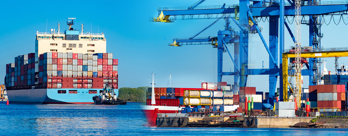 Marine logistics hub. Containers ship in cargo port. Sea barge is awaiting unloading. Cargo cranes load containers onto ship. Transportation of goods by sea. Port on summer day. Oceanic logistics.